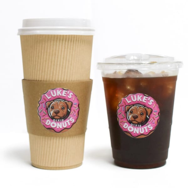 Two Luke's Dixie Donuts branded coffee cups, one hot and one iced, on a white background.