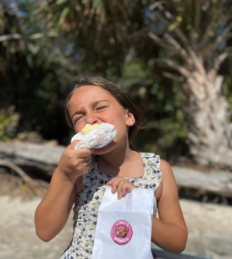 Kid enjoying a donut