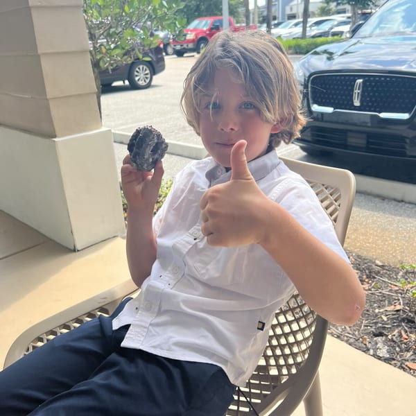 Kid enjoying a donut