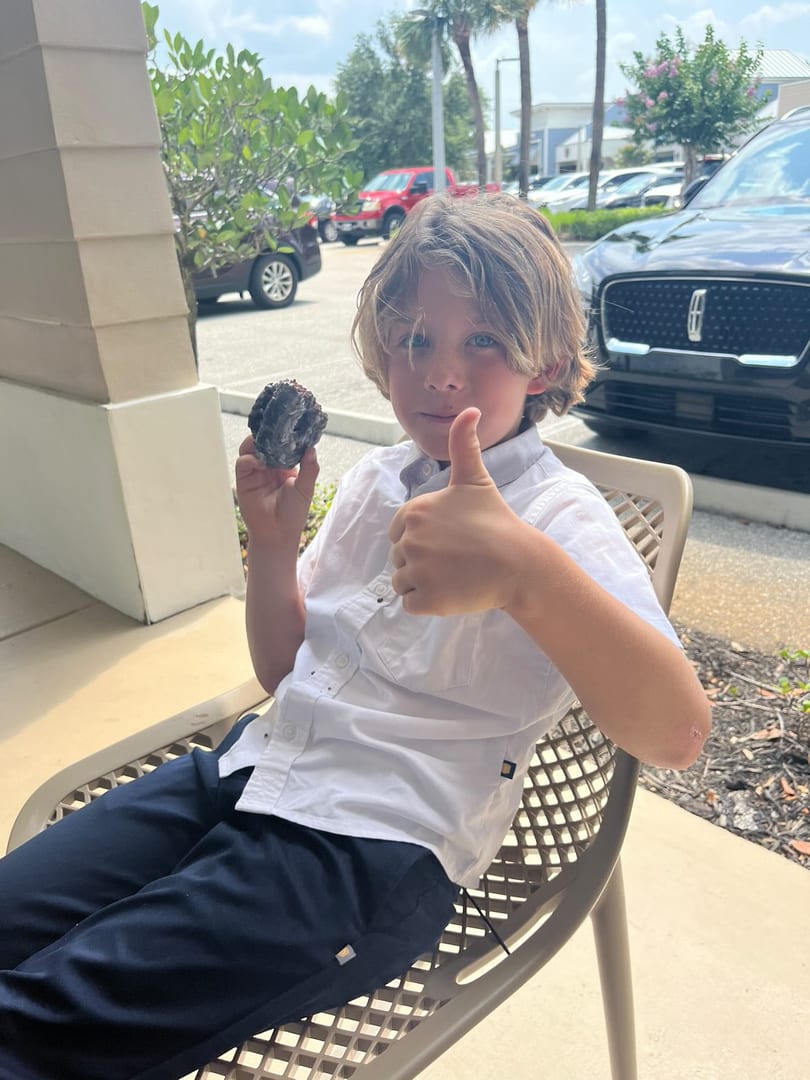 Kid enjoying a donut