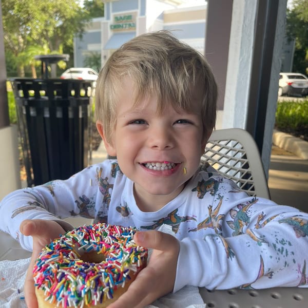 Kid enjoying a donut