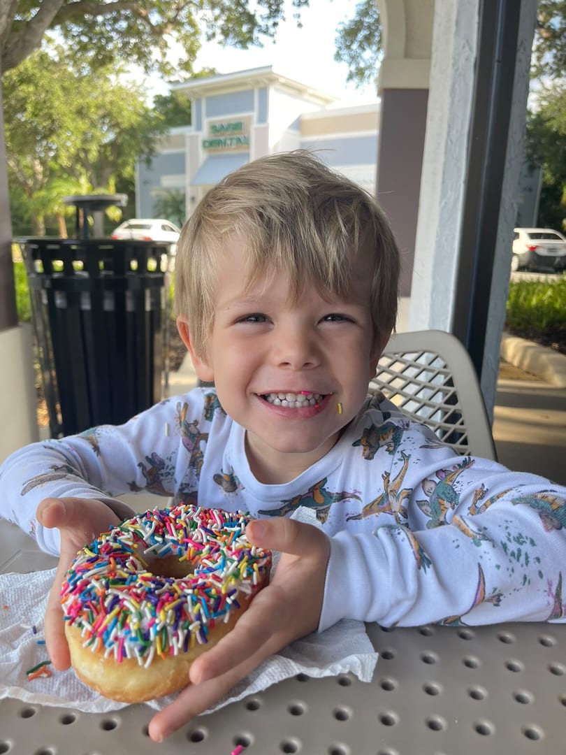 Kid enjoying a donut